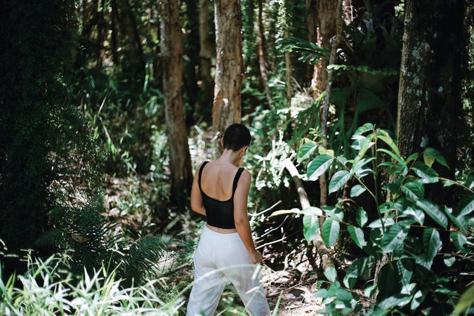 Woman walking through a forest